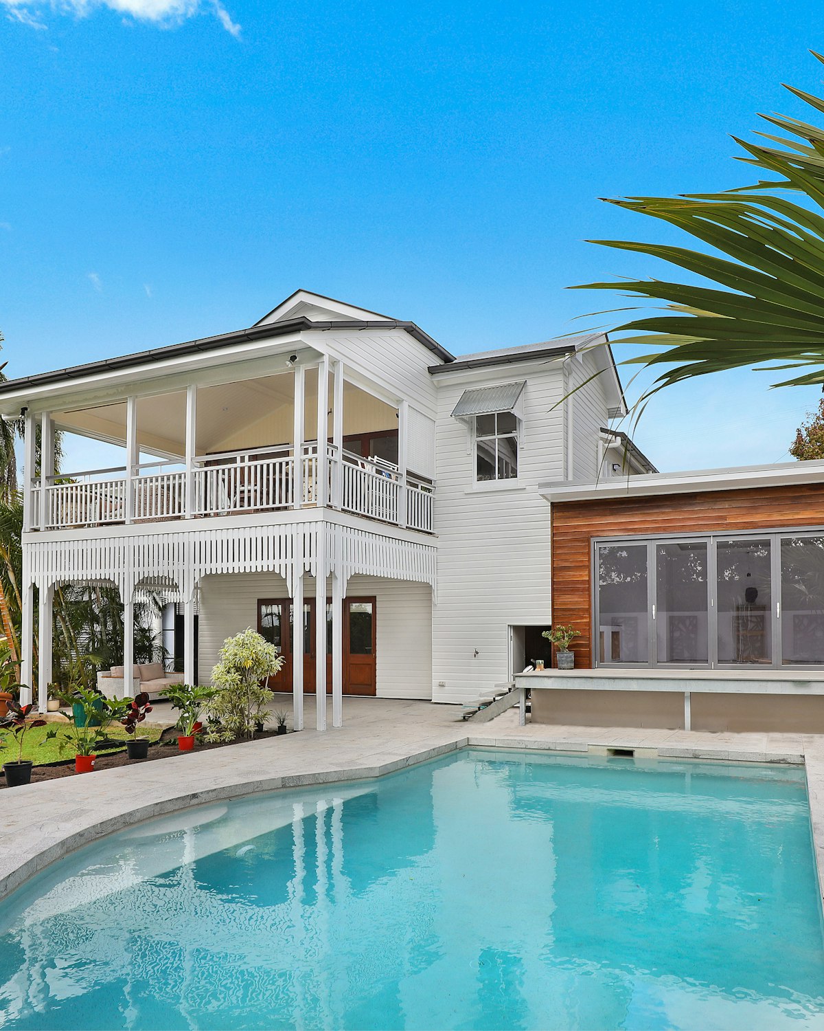 Modern luxury home exterior with a pool