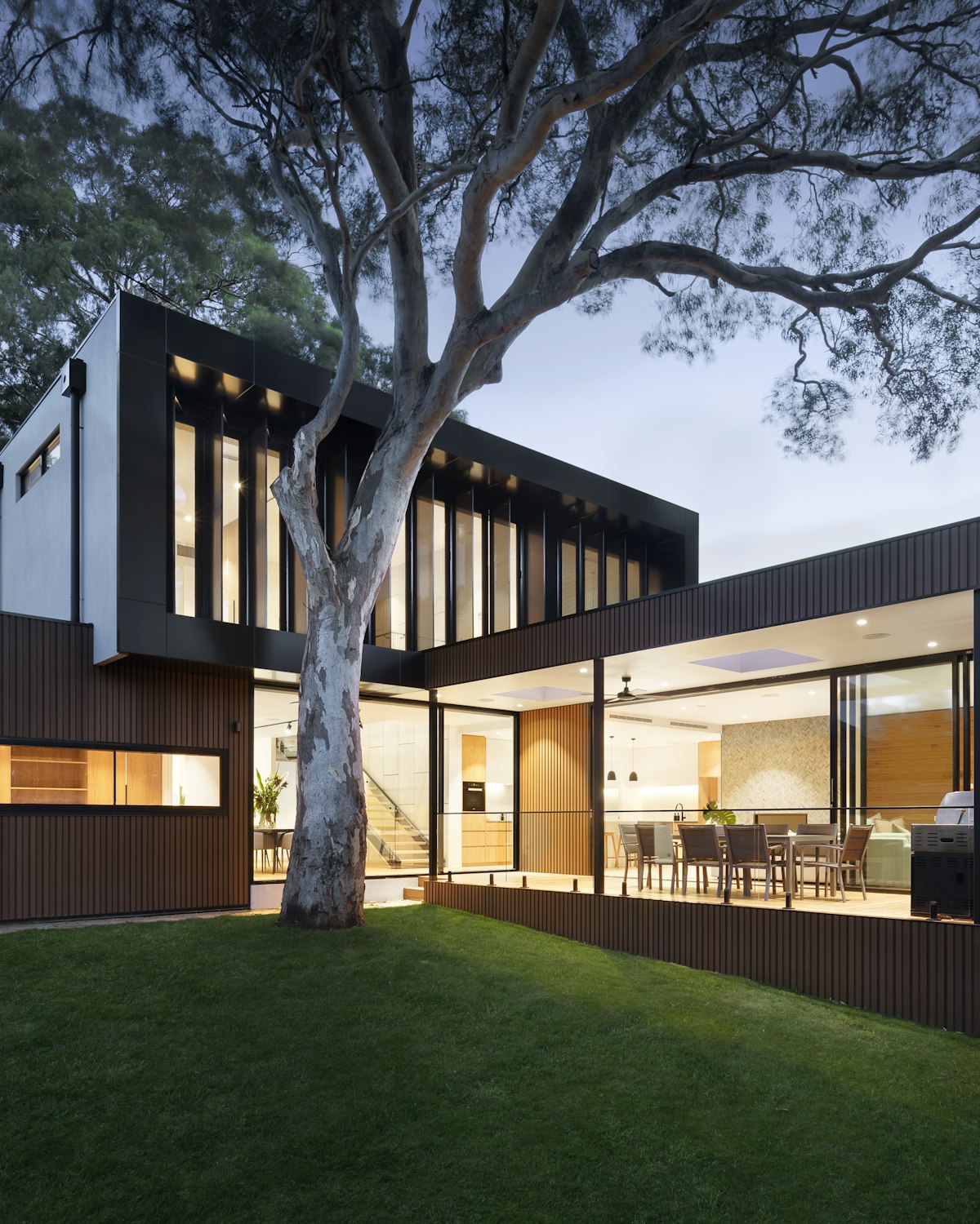 Timber and glass residence at dusk